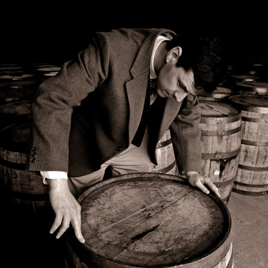 04 Dr Bill Lumsden, Director of Whisky Creation at Glenmorangie, inspecting a cask