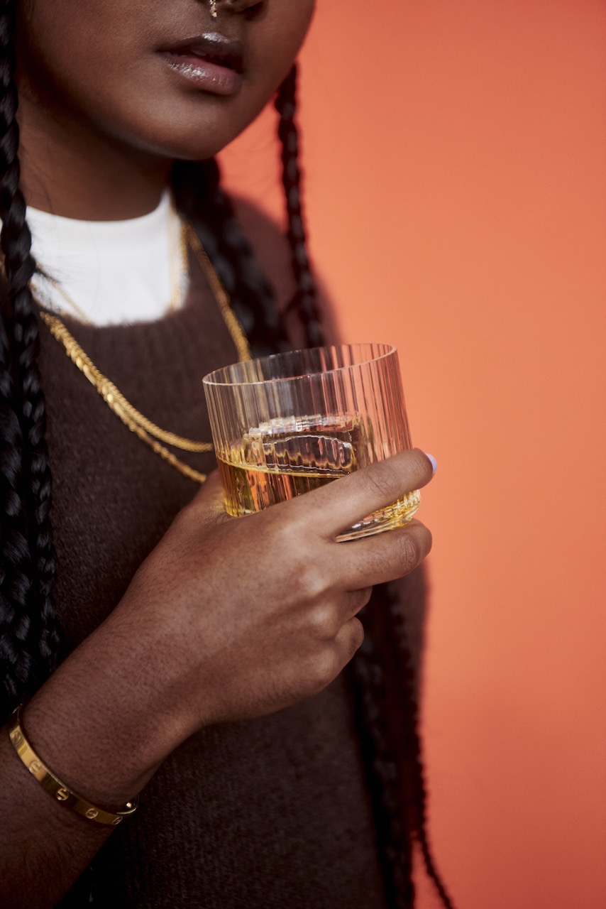 whiskey drinker sips whiskey